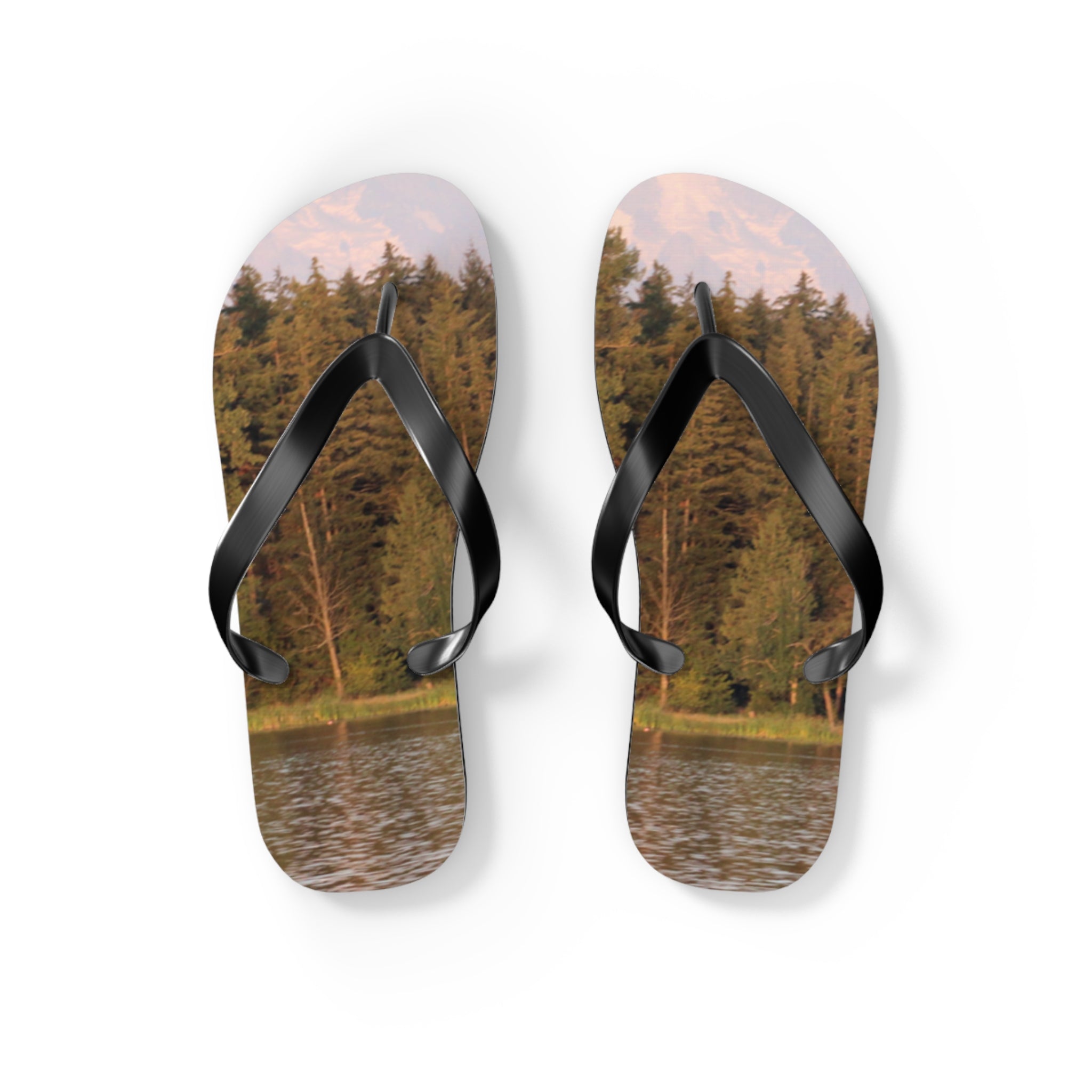 Flip-flops with a forest and mountain lake scene printed on the soles.