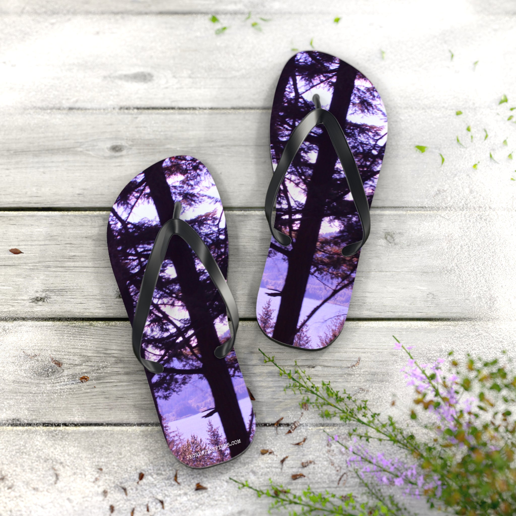 Flip-flops with a forest landscape and purple sky print.