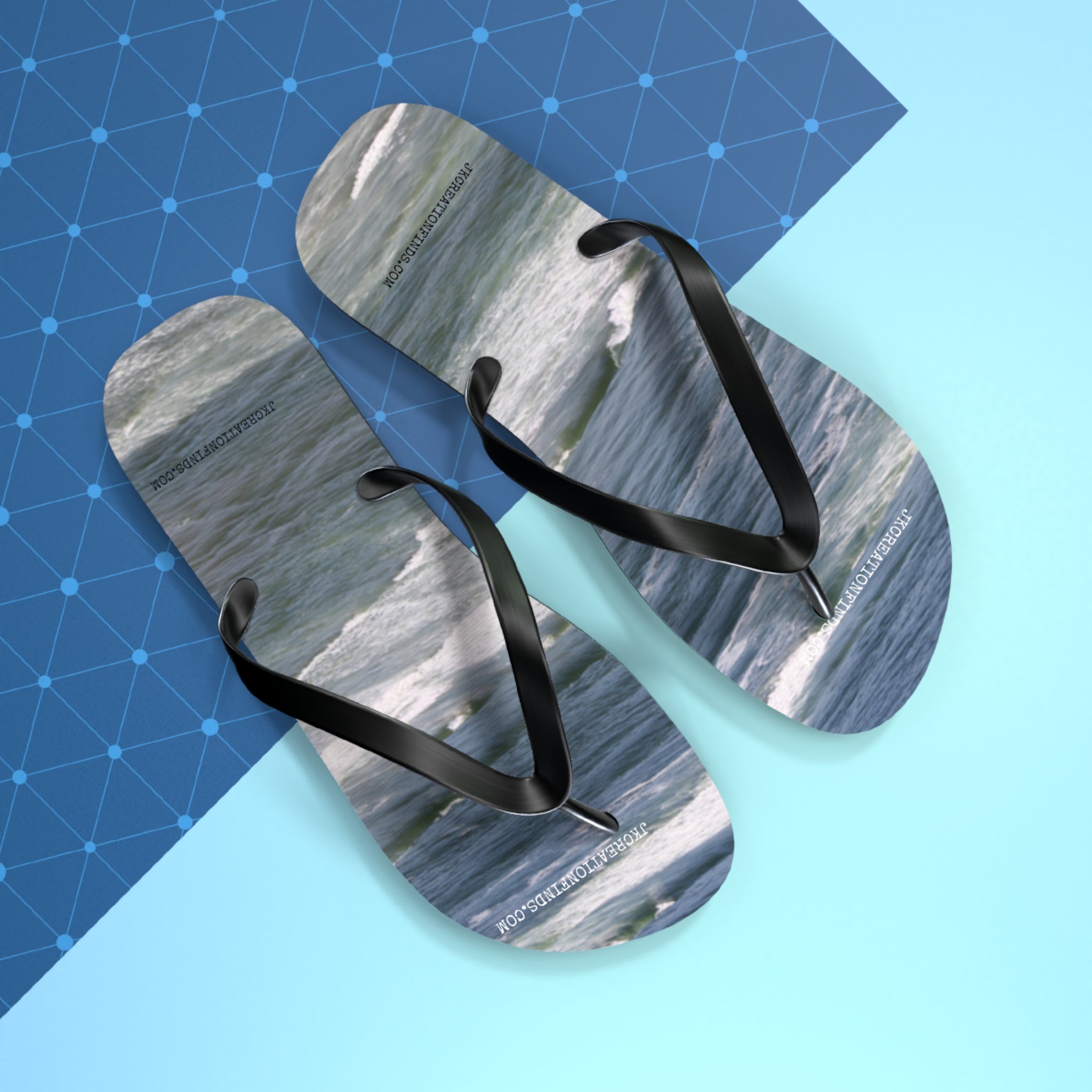 Flip-flops with ocean waves and JCREATIONS.COM text on straps.