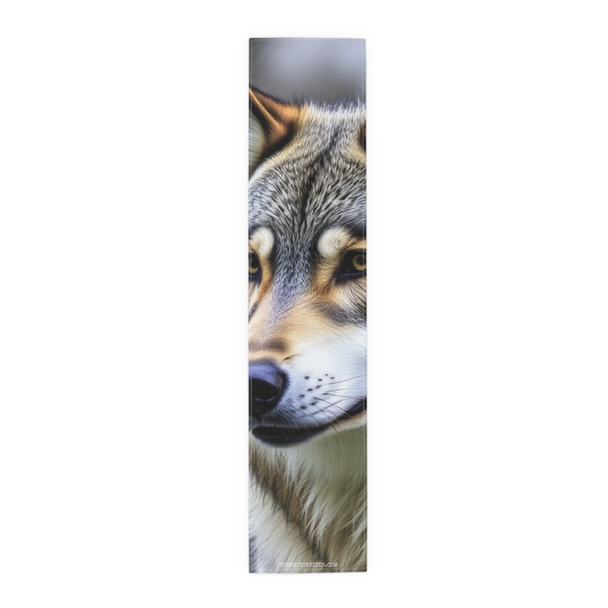 Close-up of a wolf's head with golden eyes on a white background.