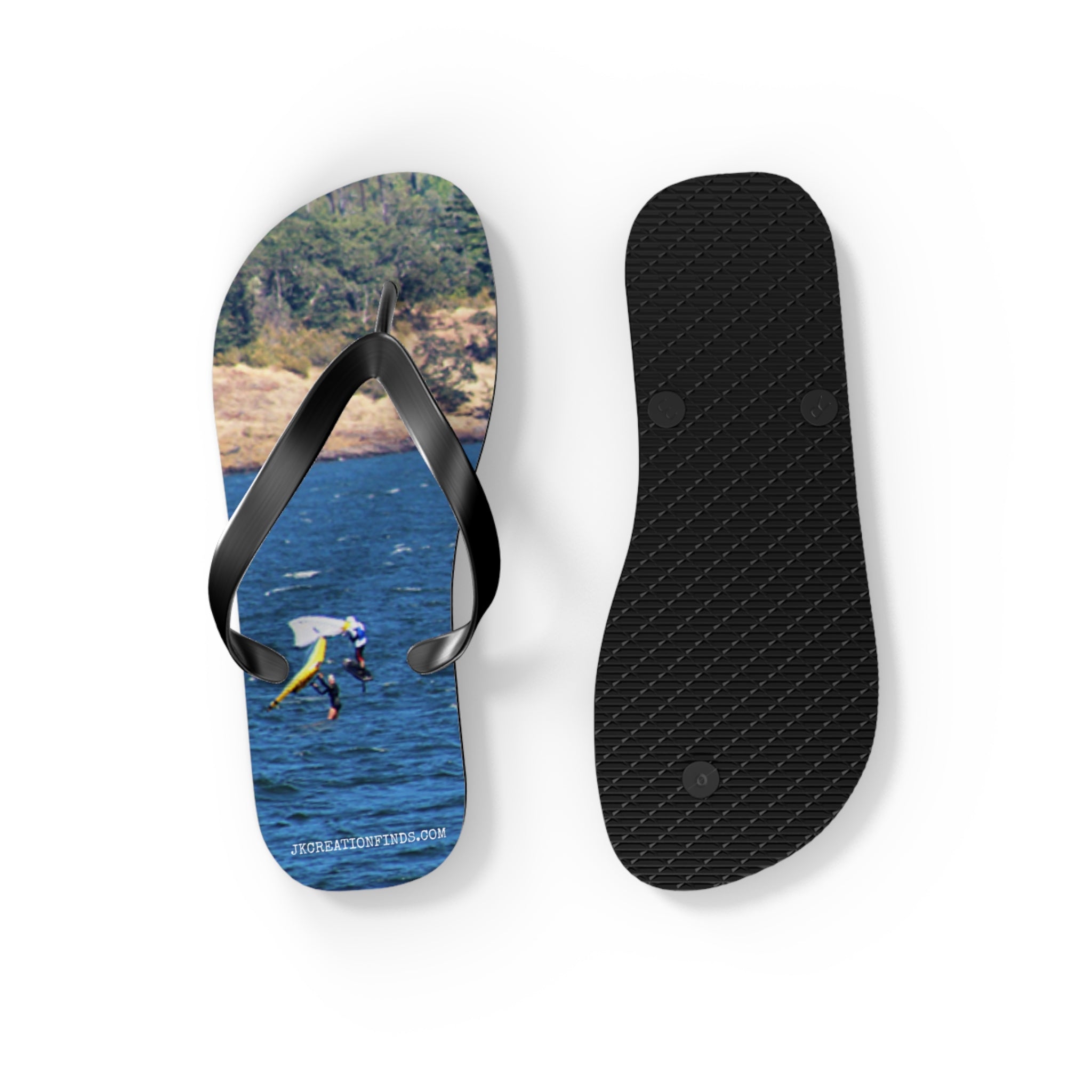 Flip-flops with a cliff diver on the left strap and textured sole on the right.