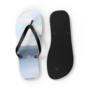 Flip-flops with a lake and forest scene on the left, black sole on the right.