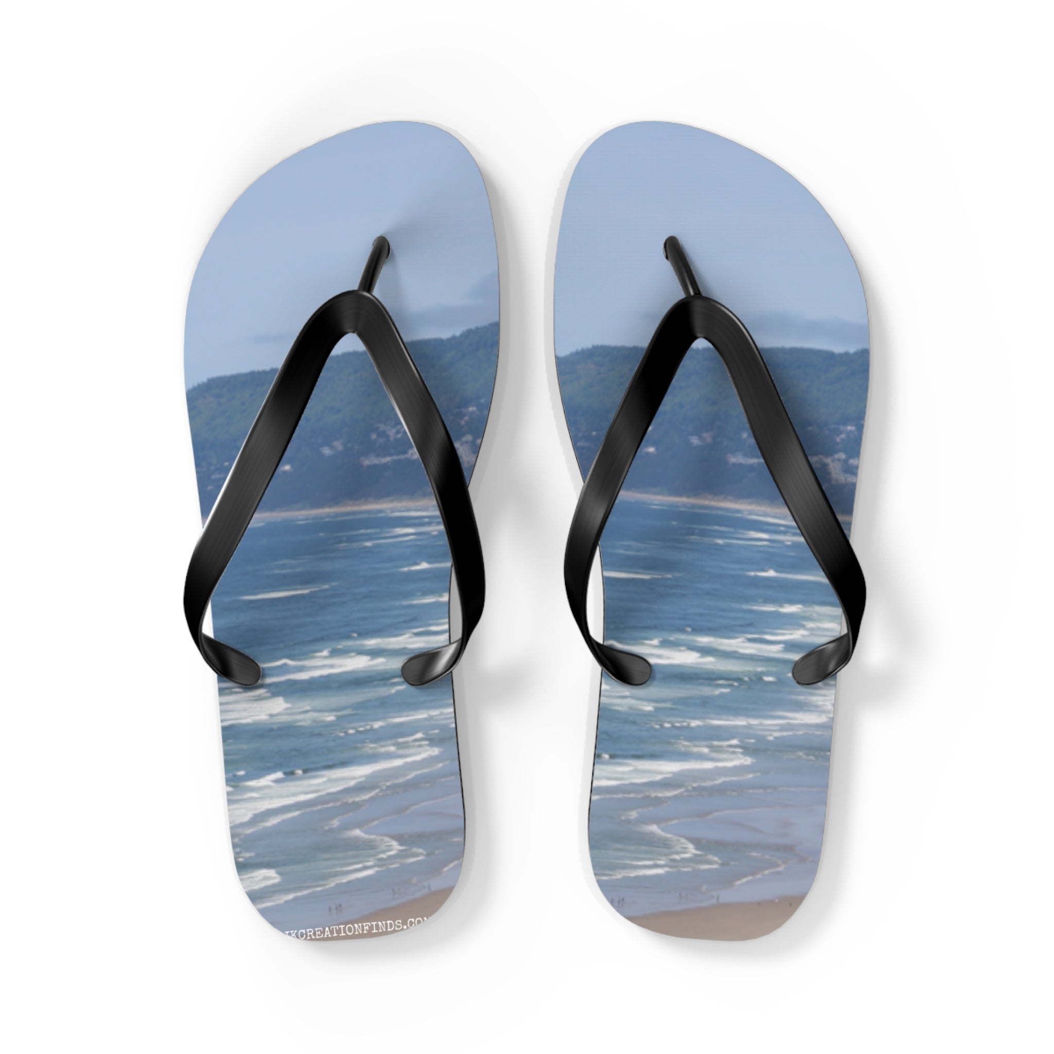 Flip-flops with a beach and ocean landscape printed on them.