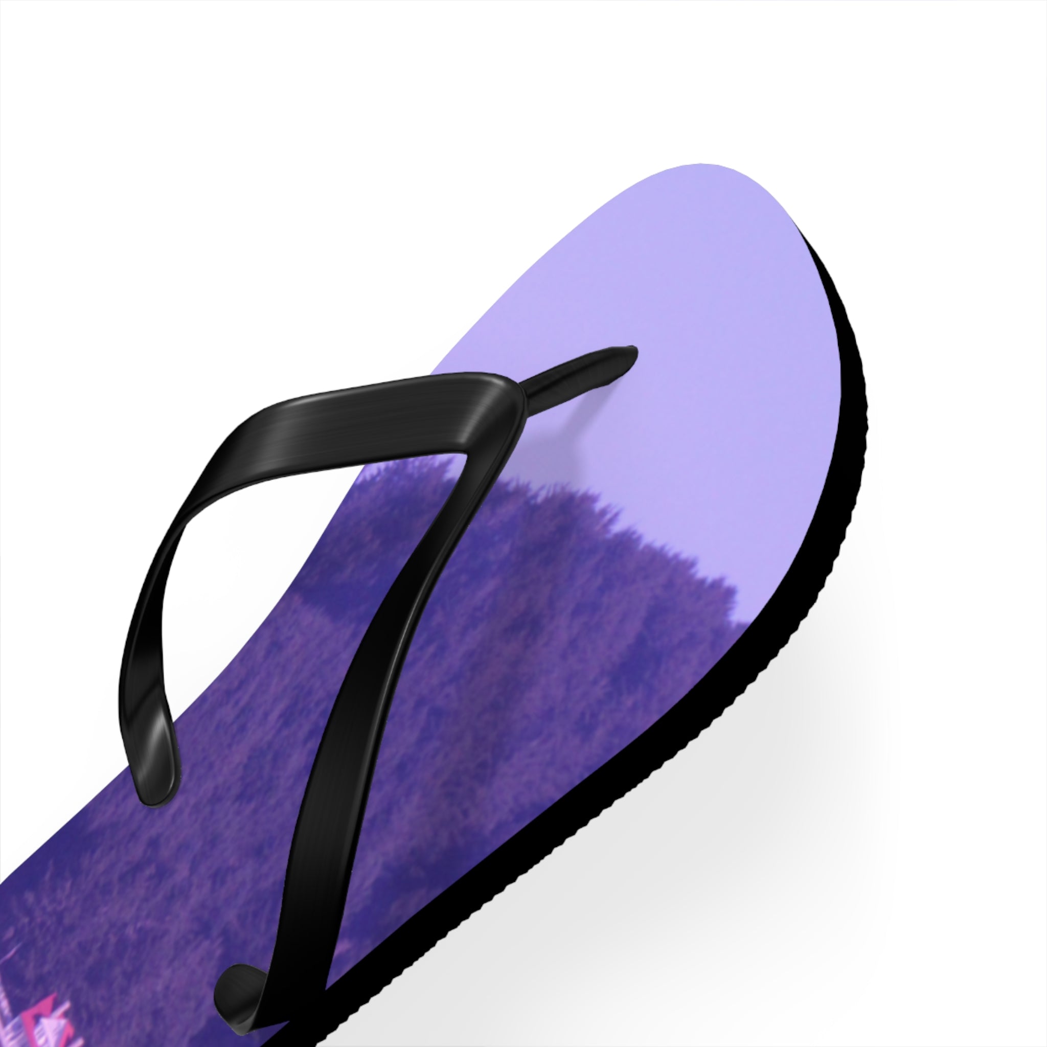 Purple flip-flop with a floral pattern, close-up view.