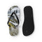 Black flip-flops with a waterfall landscape print on one sole.