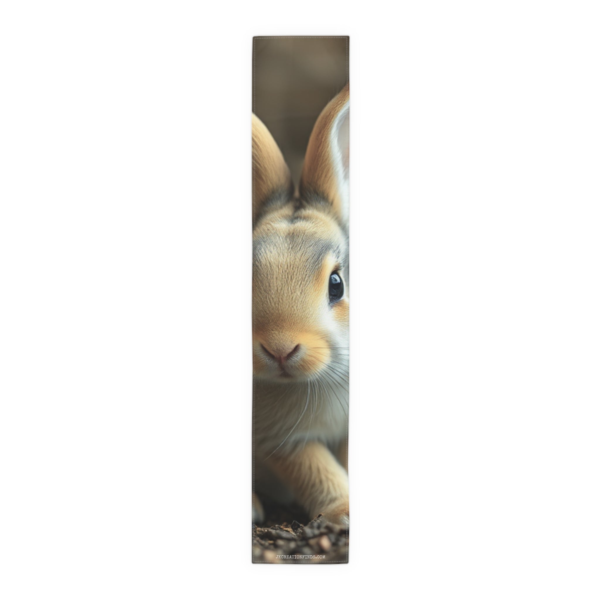 Close-up of a fluffy brown rabbit's face with long ears.