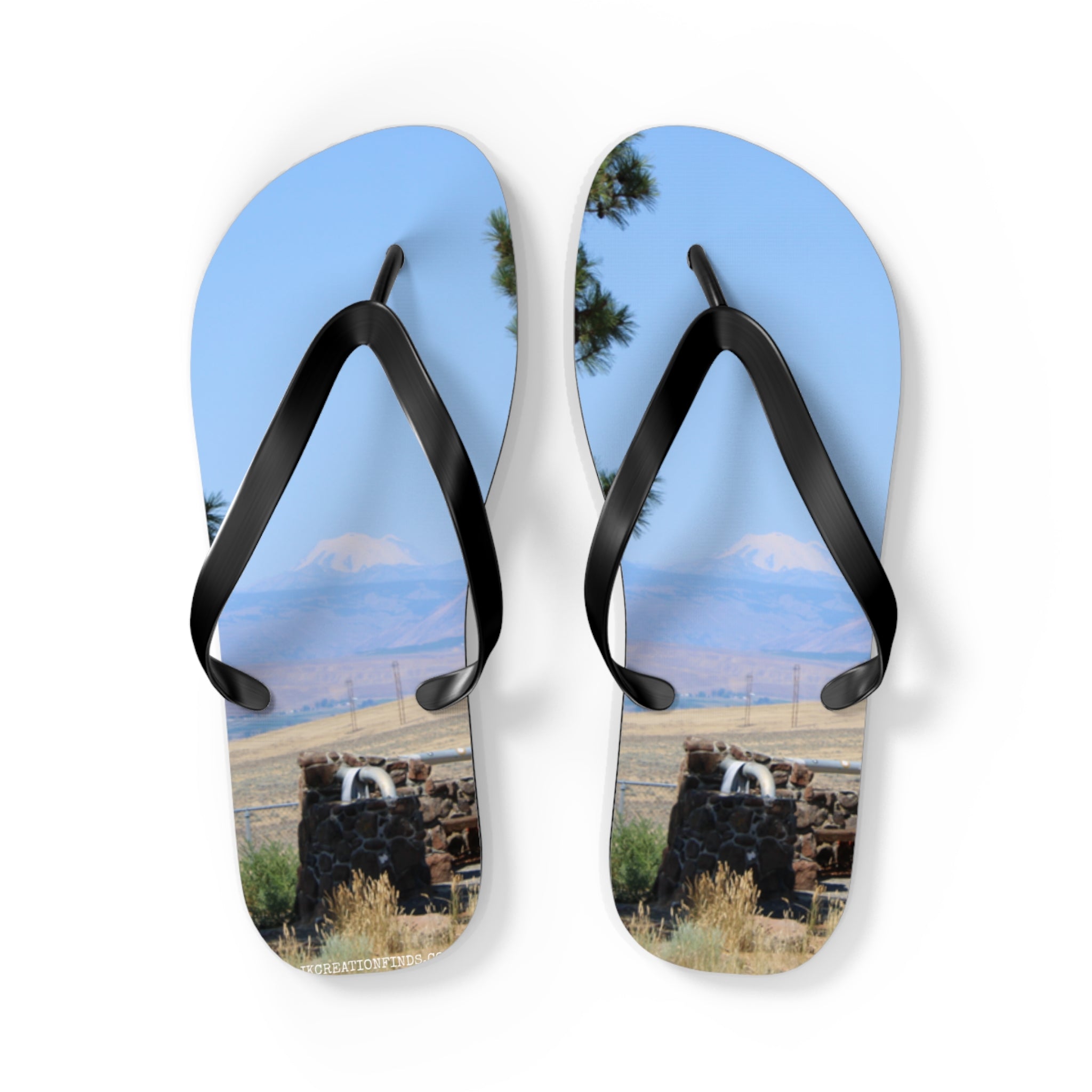 Flip-flops with a landscape scene of mountains and rock fountains.