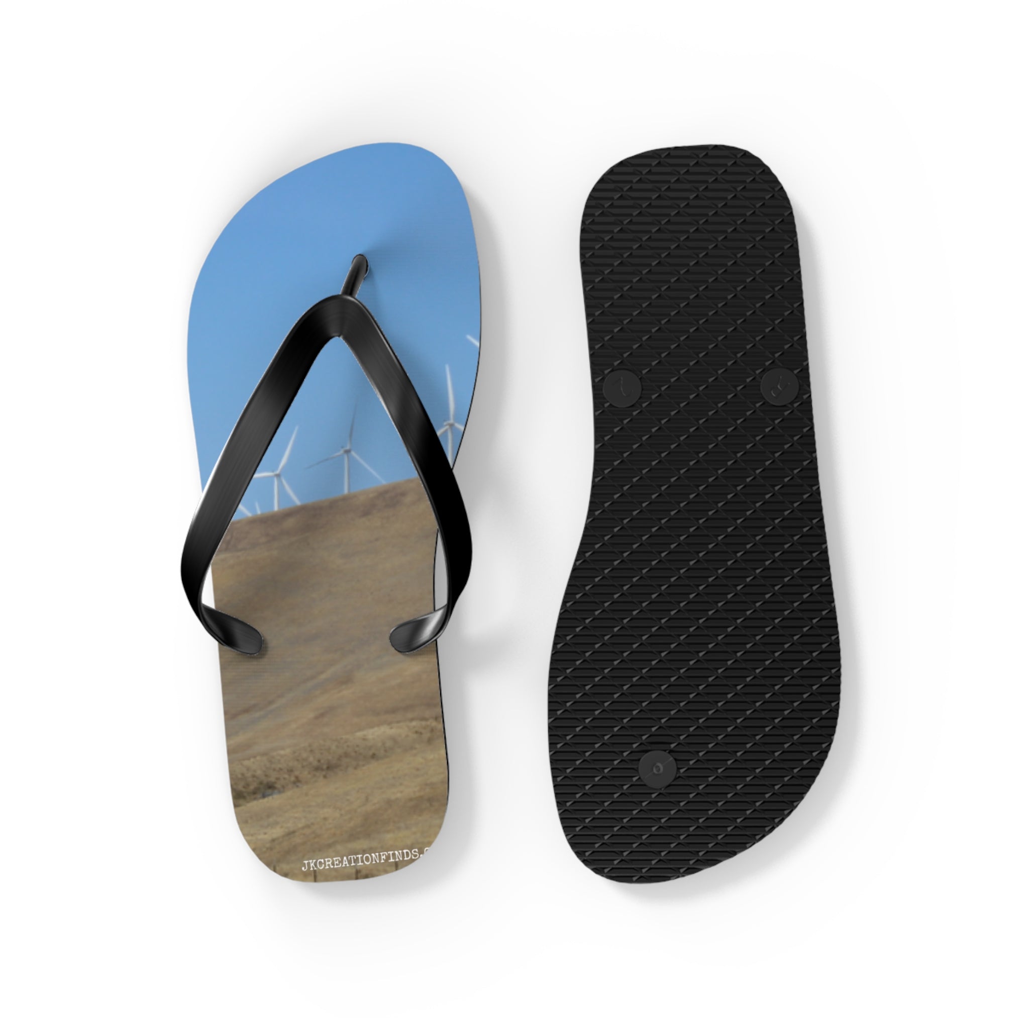 Flip-flops with wind turbines on a hillside and a textured sole.