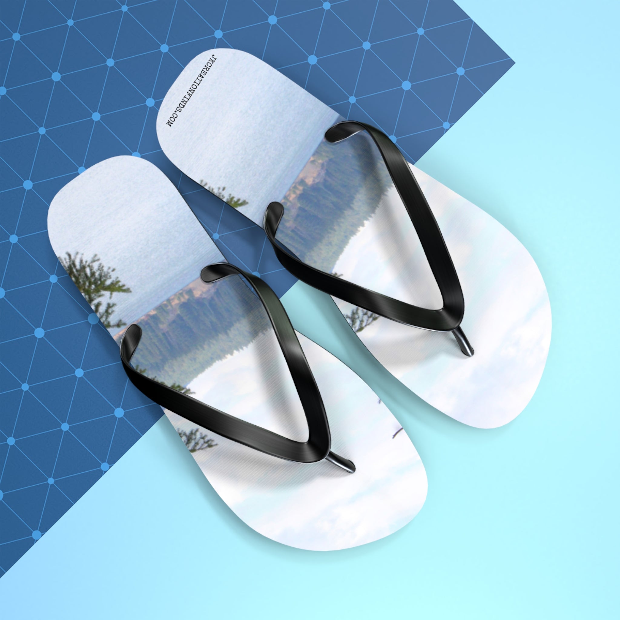 Flip-flops with a landscape scene of a lake and trees.