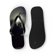 Black flip-flops with a shadowy tree line and moon graphic.