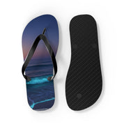 Flip-flops with a starry night ocean wave design and black textured sole.
