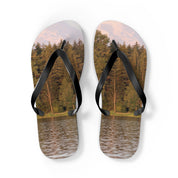Flip-flops with a forest and lake scene on the soles.