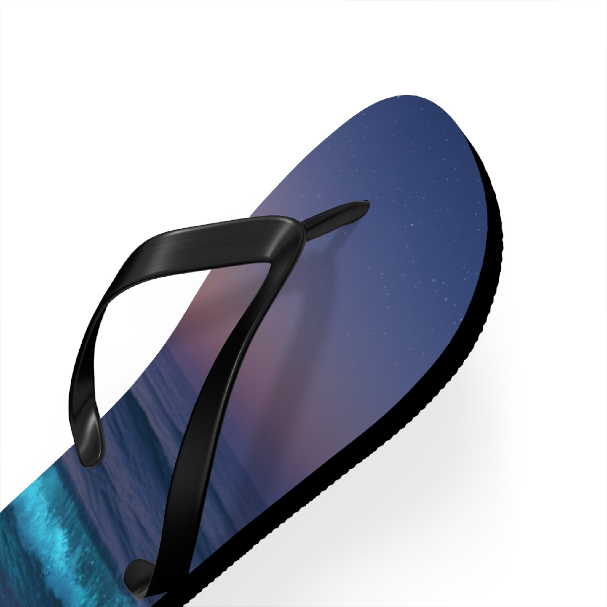 Black flip-flop with a starry night and ocean wave design.