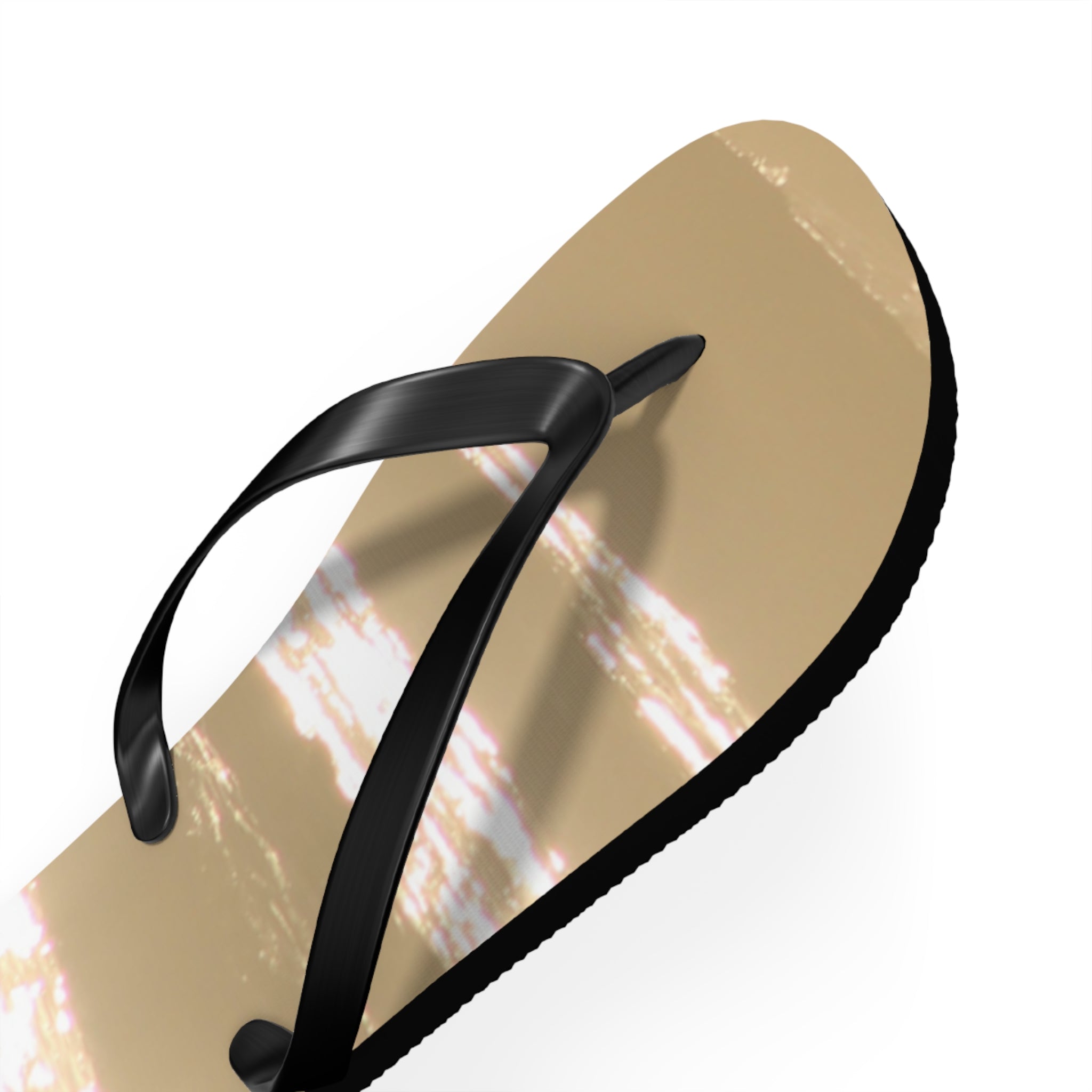 Tan flip-flop with black straps and a subtle white and gold striped pattern.