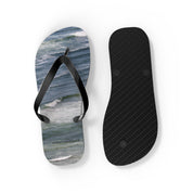Flip-flops with ocean wave design and textured sole.