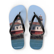 Flip-flops with a lighthouse and ocean scene.