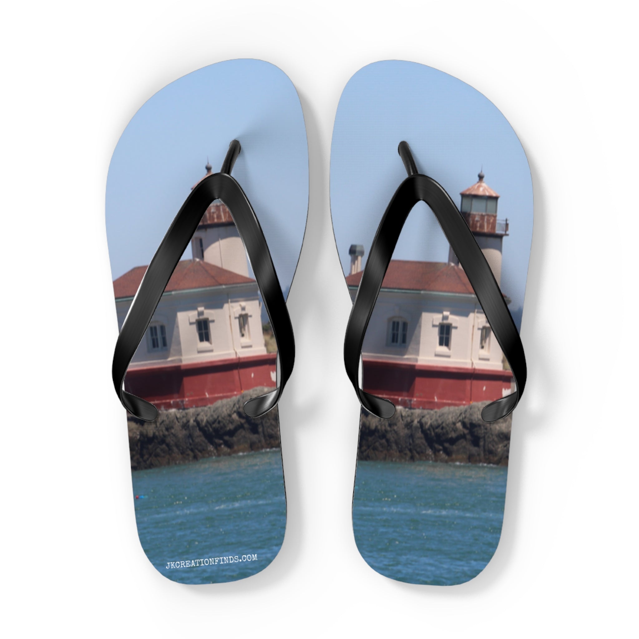Flip-flops with a lighthouse and ocean scene.