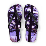 Flip-flops with a forest and lake scene on the soles.