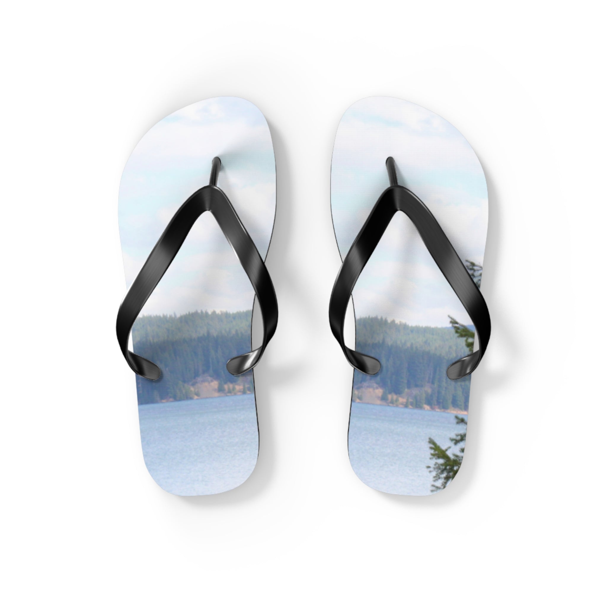 Flip flops with a lake and forest landscape scene.